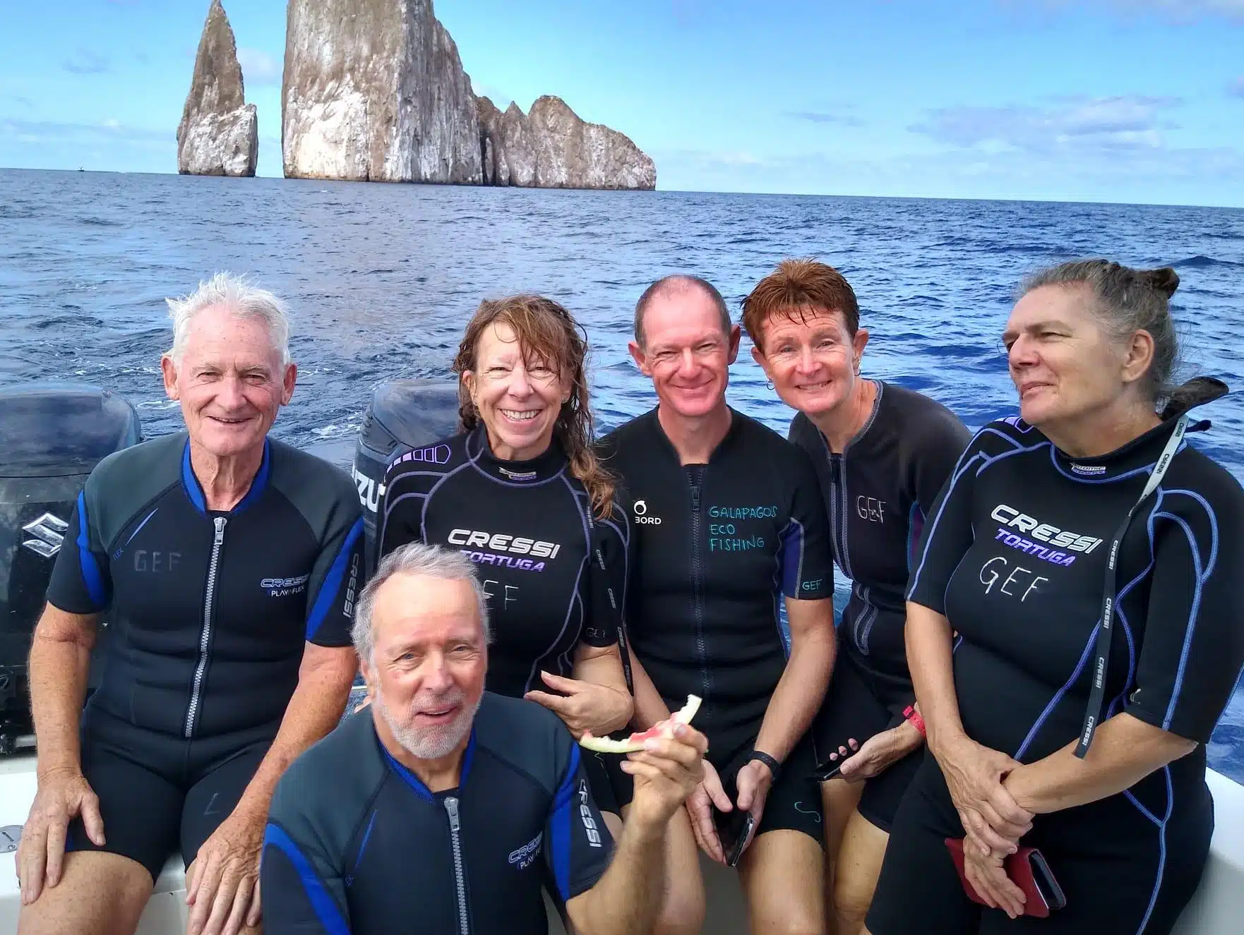 A group of over 50's Projects Abroad participants on a ship in the Galapagos Islands